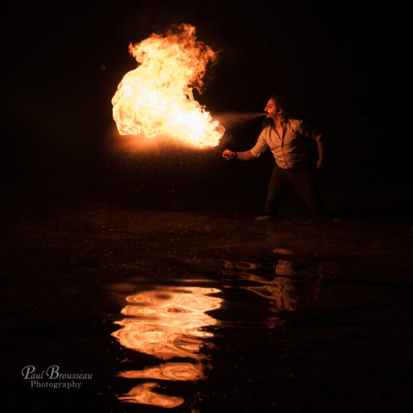 firebreather standing in water