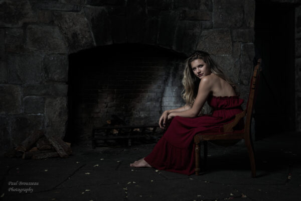 Stone Lodge, girl, red dress, barefoot, fireplace, chair